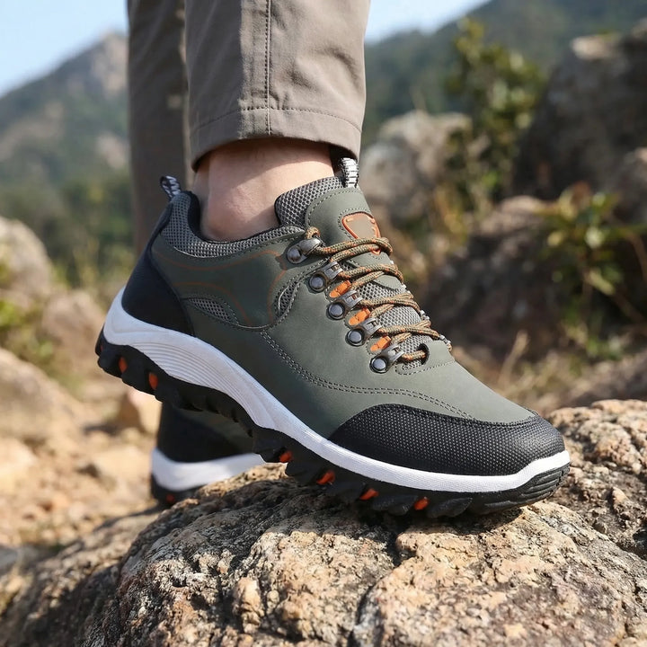 Men's waterproof low-cut hiking shoes with strong grip for outdoor trails and walking.