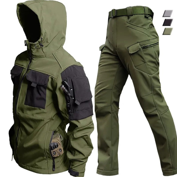 Gray men's waterproof rain suit, windproof jacket & pants for outdoor adventures & winter sports.