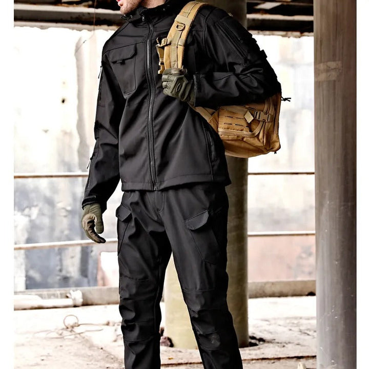 Men's functional waterproof outdoor jacket & pants set, perfect for hiking, trekking & winter activities.