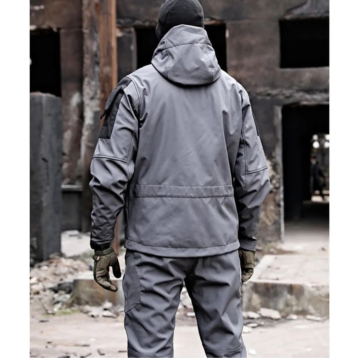 Complete men's waterproof outdoor set: windproof jacket and pants in black, essential for rain and adventure.