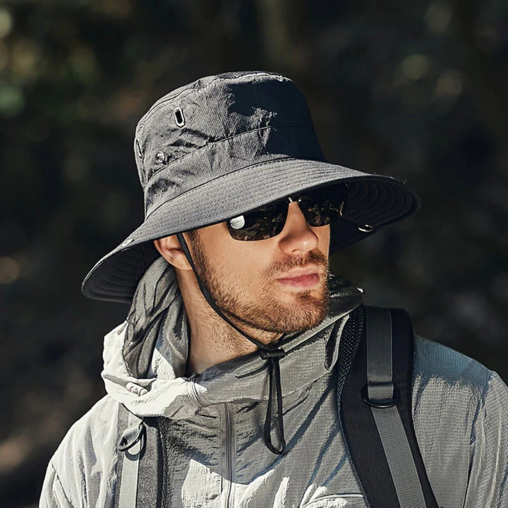 Men's wide brim sun hat with chin strap, offering UV protection for outdoor activities like hiking and fishing.