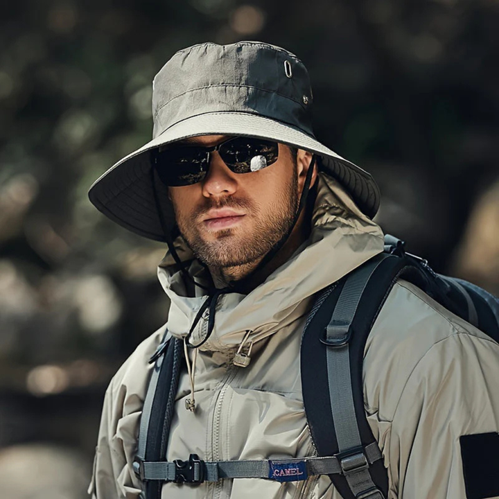 Protective men's wide brim sun hat with adjustable chin strap for beach, travel, and summer outdoor adventures.