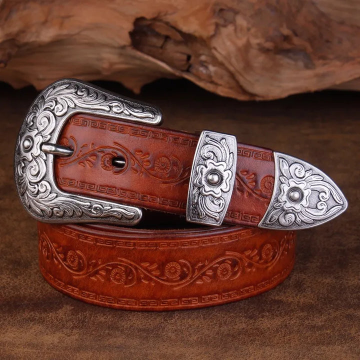 Distinctive metal buckle on a men's engraved western belt, adding a vintage touch to any cowboy outfit.