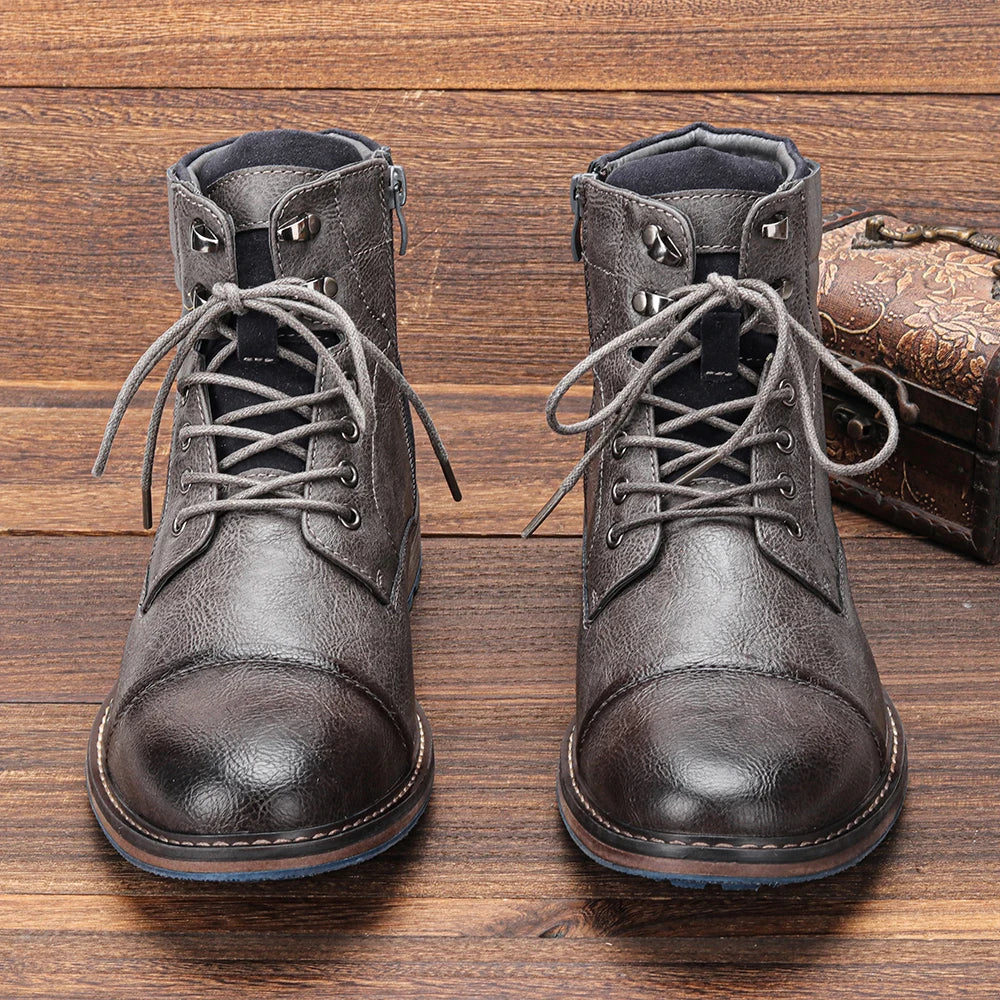 Sleek men's cap toe ankle boots with lace-up detail. Perfect for smart casual or dress events.