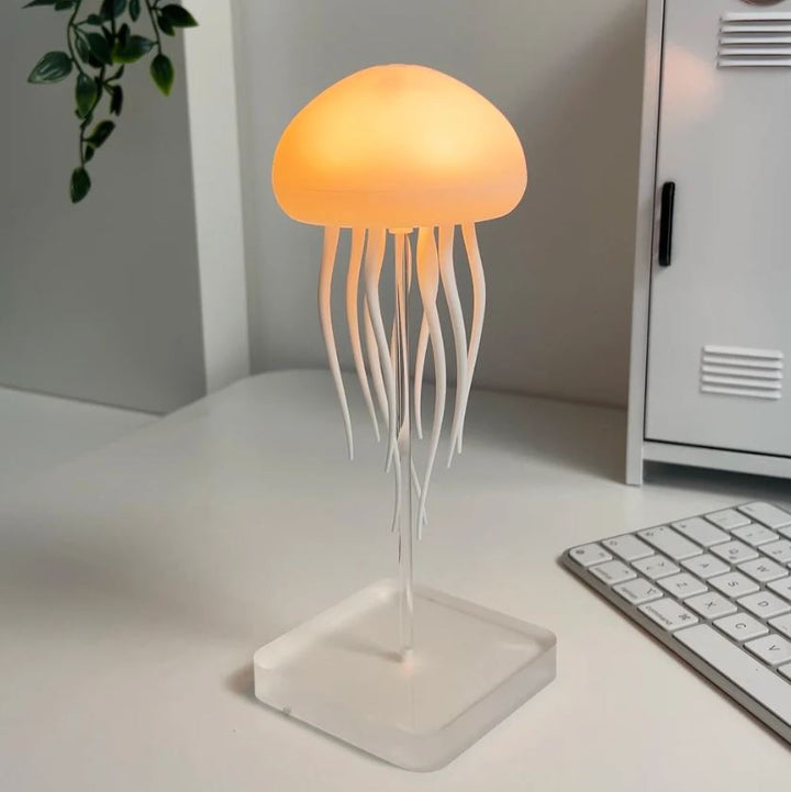 Mesmerizing LED jellyfish lamp, dynamic color-changing mood light for relaxing home or desk decor.