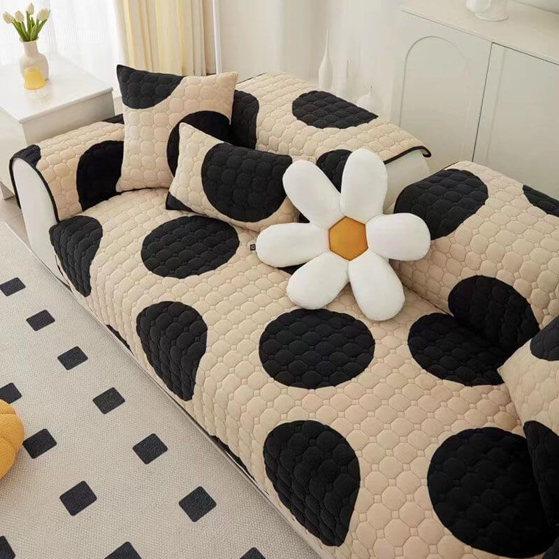 Elegant milk velvet sofa protector in a sophisticated black, providing non-slip comfort and home decor.