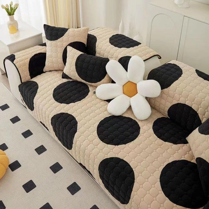 Elegant milk velvet sofa protector in a sophisticated black, providing non-slip comfort and home decor.