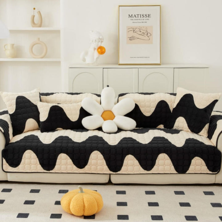 Pet-friendly milk velvet couch cover in a luxurious brown, featuring non-slip backing for sectional sofa.