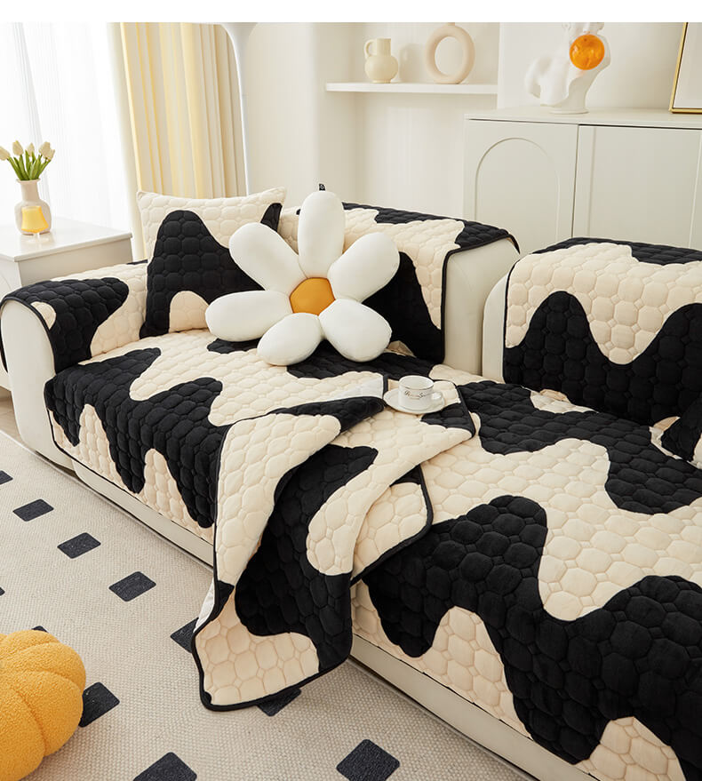 Overhead view of a living room sofa with a non-slip milk velvet couch cover, ensuring full furniture protection.
