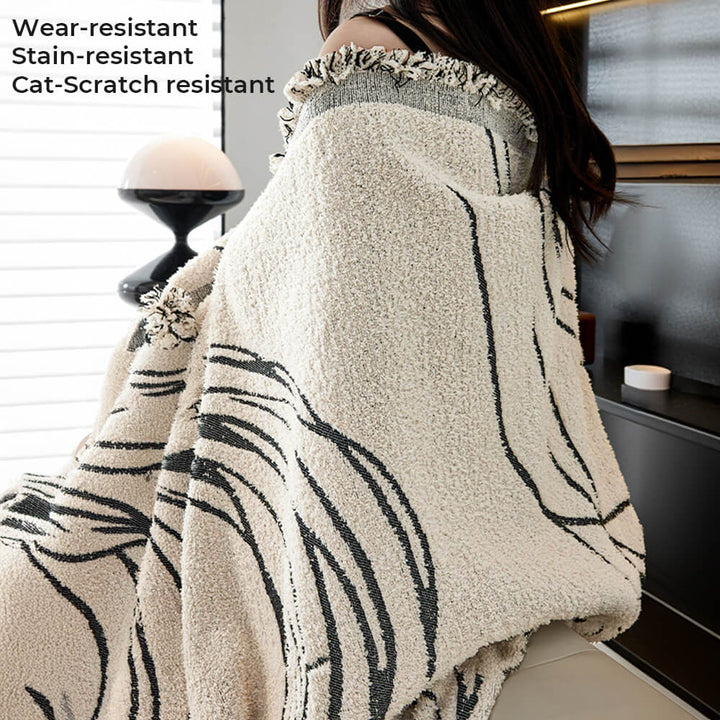 Above view of gray pet-friendly couch cover draped over a sofa, highlighting its minimalist design