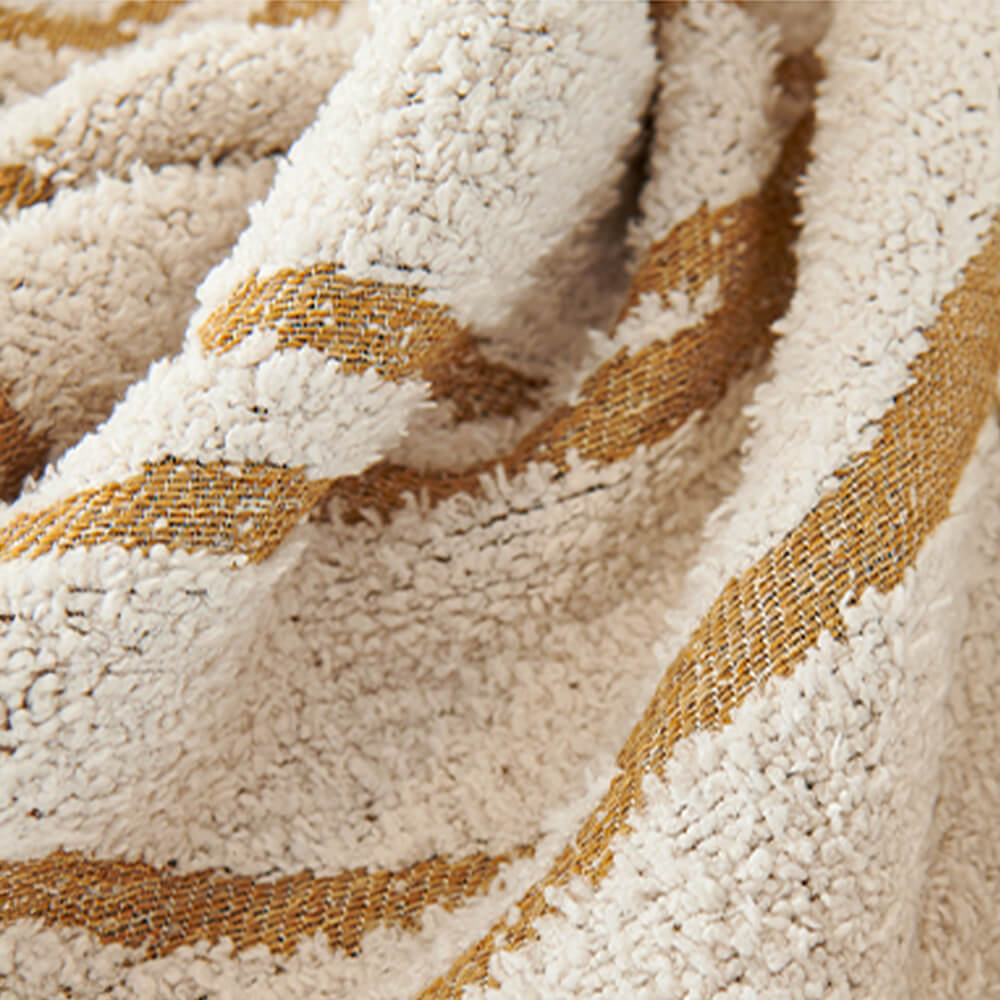 Washable pet-friendly couch cover folded neatly, ready for use or storage, home decor accent