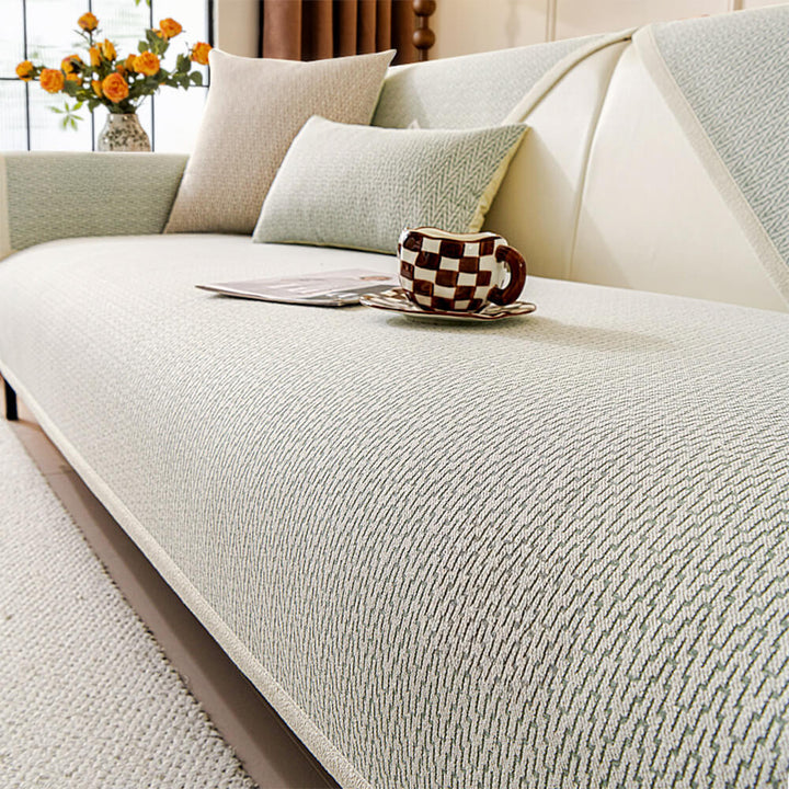 Scratch resistant chenille couch cover in a muted color, protecting furniture from pets