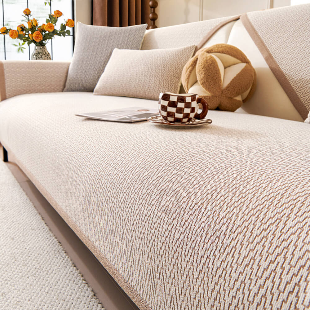 Anti-slip minimalist chenille couch cover draped over a modern sofa, functional decor