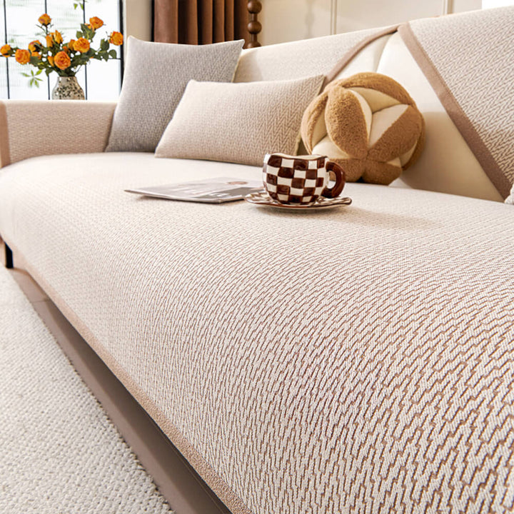 Anti-slip minimalist chenille couch cover draped over a modern sofa, functional decor