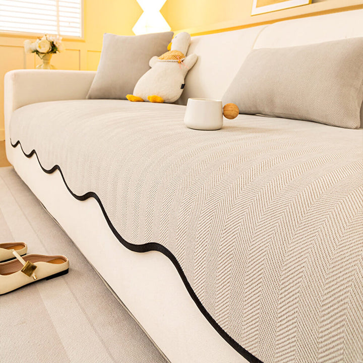 Various color options of non-slip herringbone chenille couch covers displayed, all with wavy edges.
