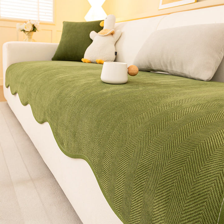 Close-up of the durable chenille fabric on a minimalist herringbone couch cover, showcasing its machine washable quality.