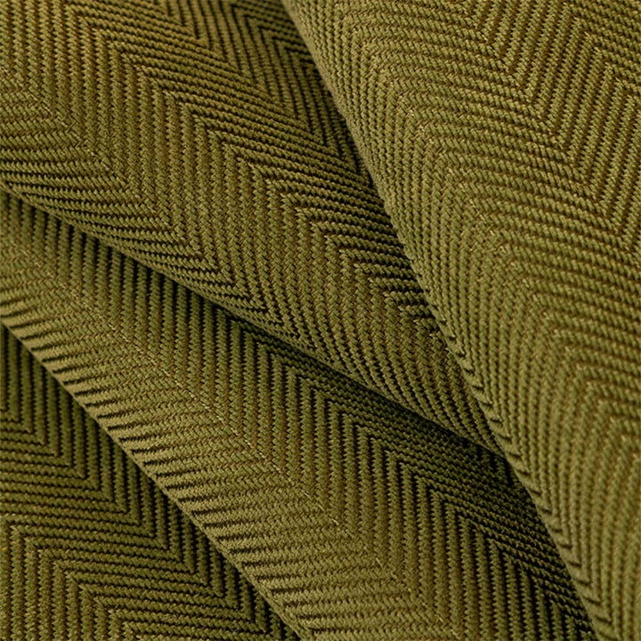 Close-up of minimalist herringbone chenille fabric texture, showcasing the non-slip wavy edge of a couch cover.