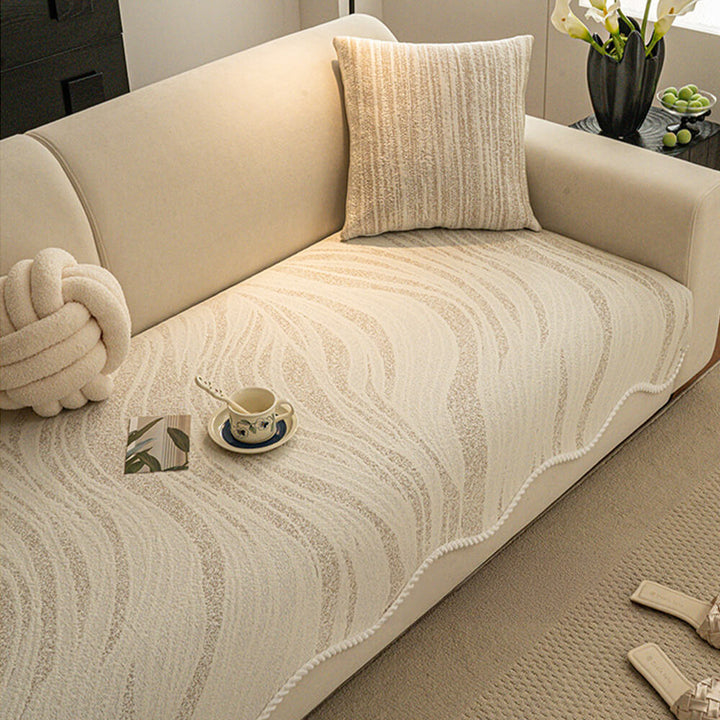 Close-up of ice silk fabric on couch cover, showing braided edge detail and smooth texture, summer