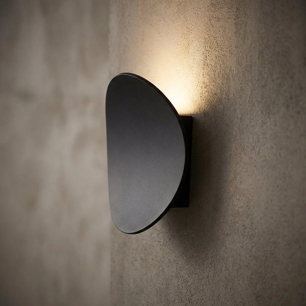 Minimalist Serevex LED wall sconce for modern interiors, provides elegant uplight & ambient home lighting.