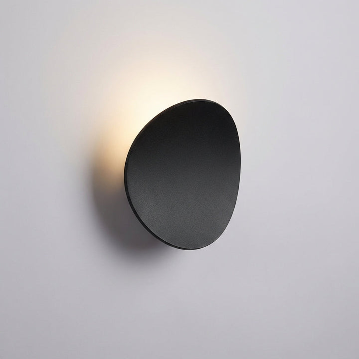 Contemporary minimalist LED wall sconce, sleek design, ideal modern lighting for ambient, energy-efficient home decor.