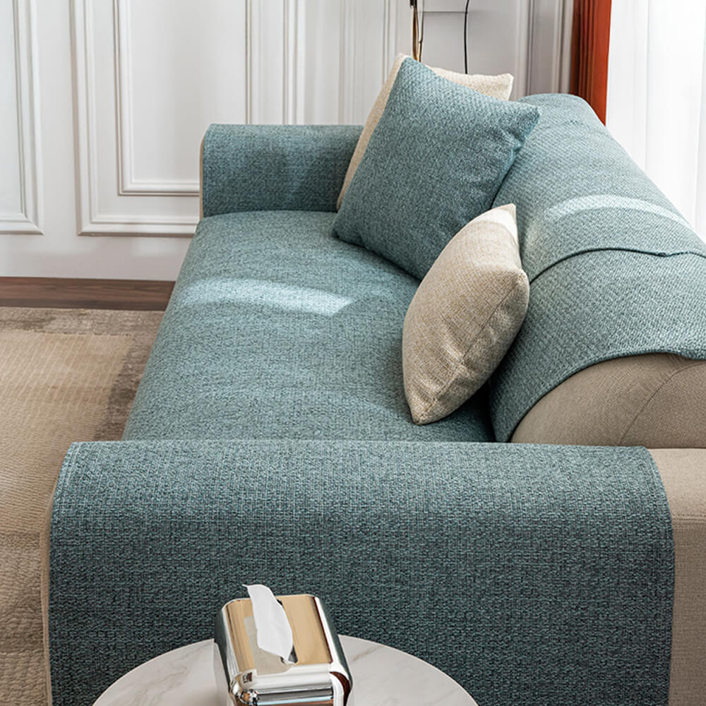 Stylish solid cream couch cover, breathable fabric for a minimalist living room, easy to clean.
