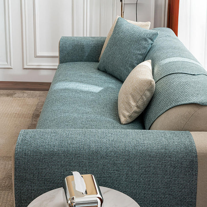 Stylish solid cream couch cover, breathable fabric for a minimalist living room, easy to clean.