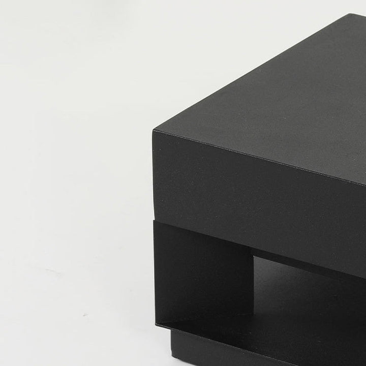 Close-up of LumaBloc minimalist square outdoor LED wall light on a modern home exterior. Weatherproof design.