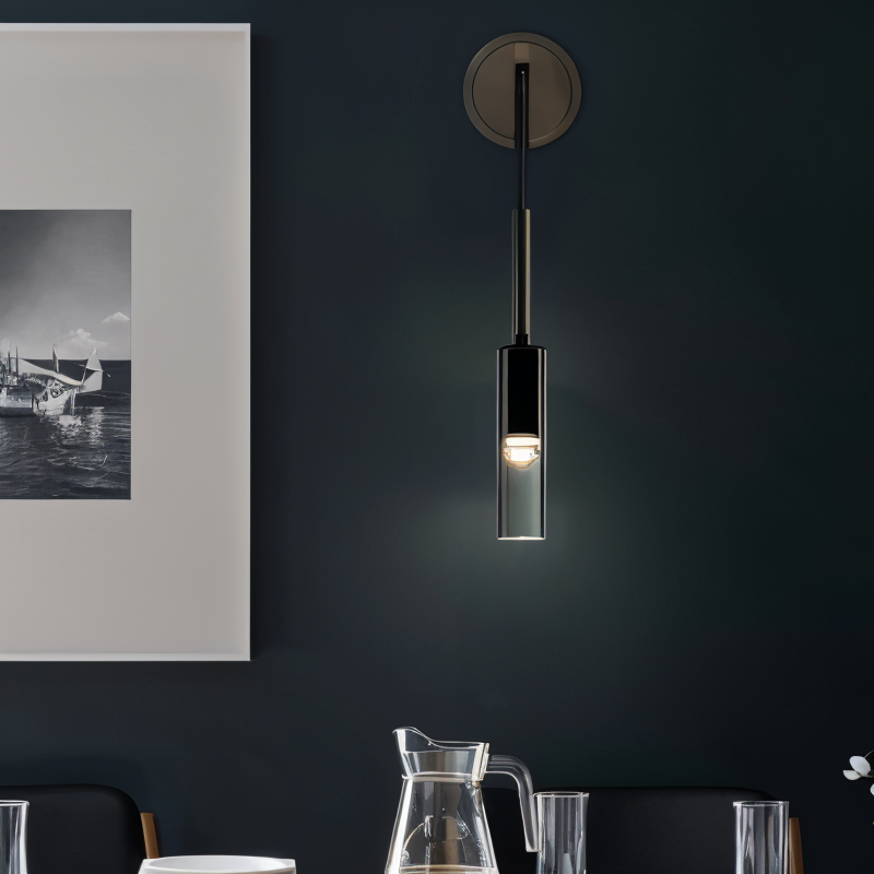 Minimalist metal wall lamp with sophisticated smoke glass sphere, ideal for contemporary and elegant interiors.