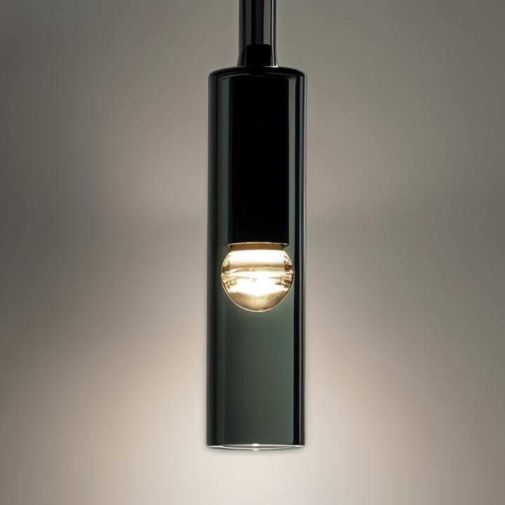 Sleek minimalist wall lamp in metal with a smoked glass sphere, enhancing modern interior design.