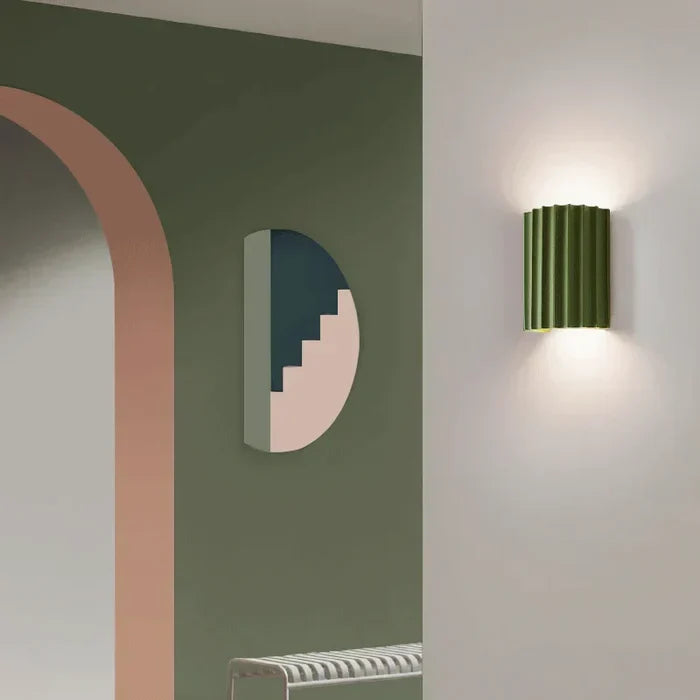 Modern wall sconce illuminating spaces with a soft glow, perfect for elevated home decor.
