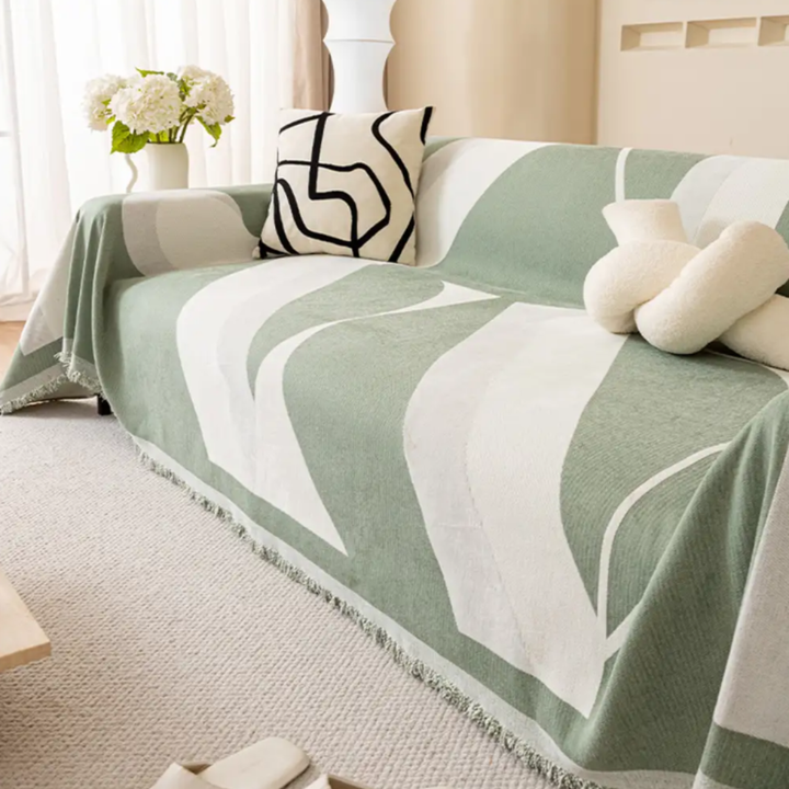 Pet-friendly modern art chenille sofa throw with non-slip backing, adding home decor and protection to a couch.