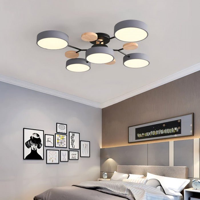 Energy-efficient LED ceiling light, sleek Nordic branching design, warm white illumination.