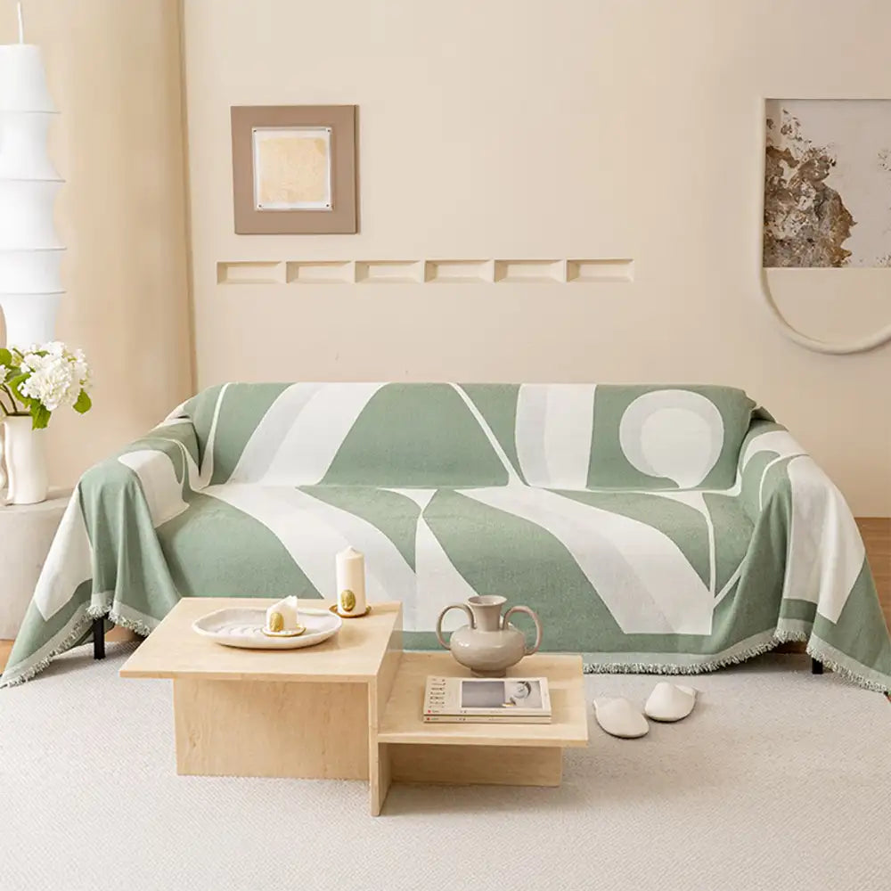 Corner detail of chenille sofa protector, showing quality stitching and all-season fabric