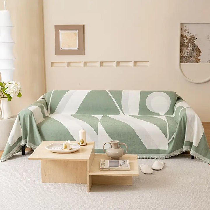 Corner detail of chenille sofa protector, showing quality stitching and all-season fabric