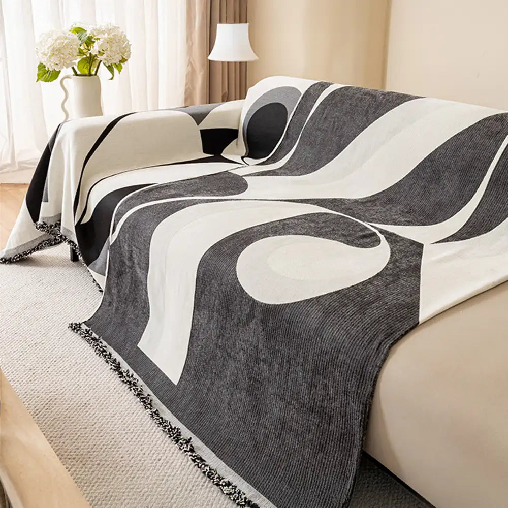 Beige chenille sofa cover, universal fit, guarding furniture, with decorative fringe accent