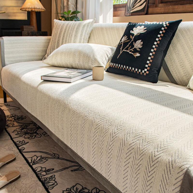 Modern home decor solution: a comfortable chenille sofa throw providing anti-scratch benefits.