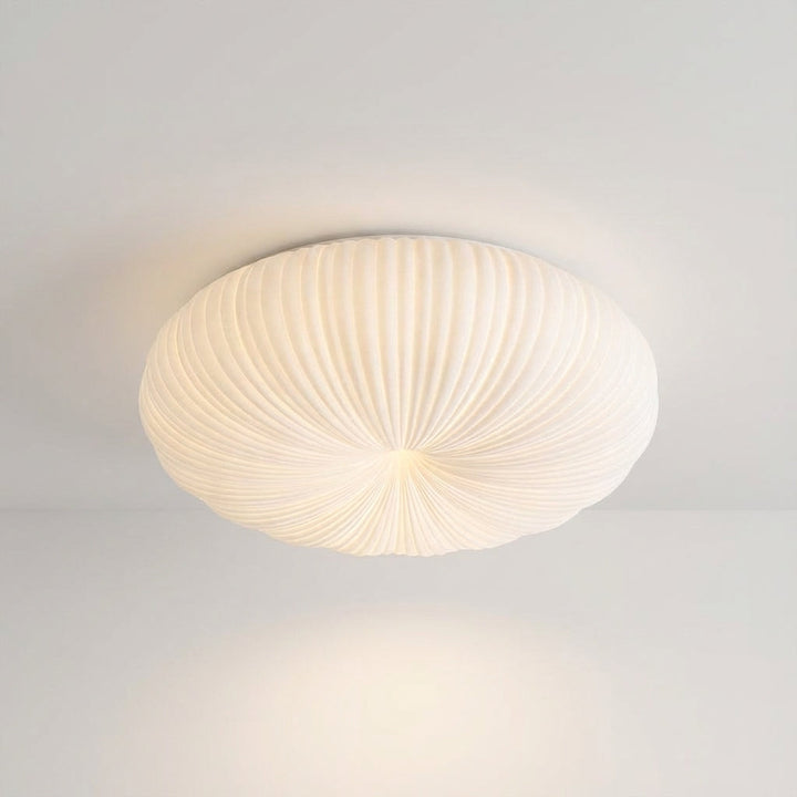 Energy-efficient LED flush mount light, ideal for modern living rooms or bedrooms, with a dimmable ambient glow.