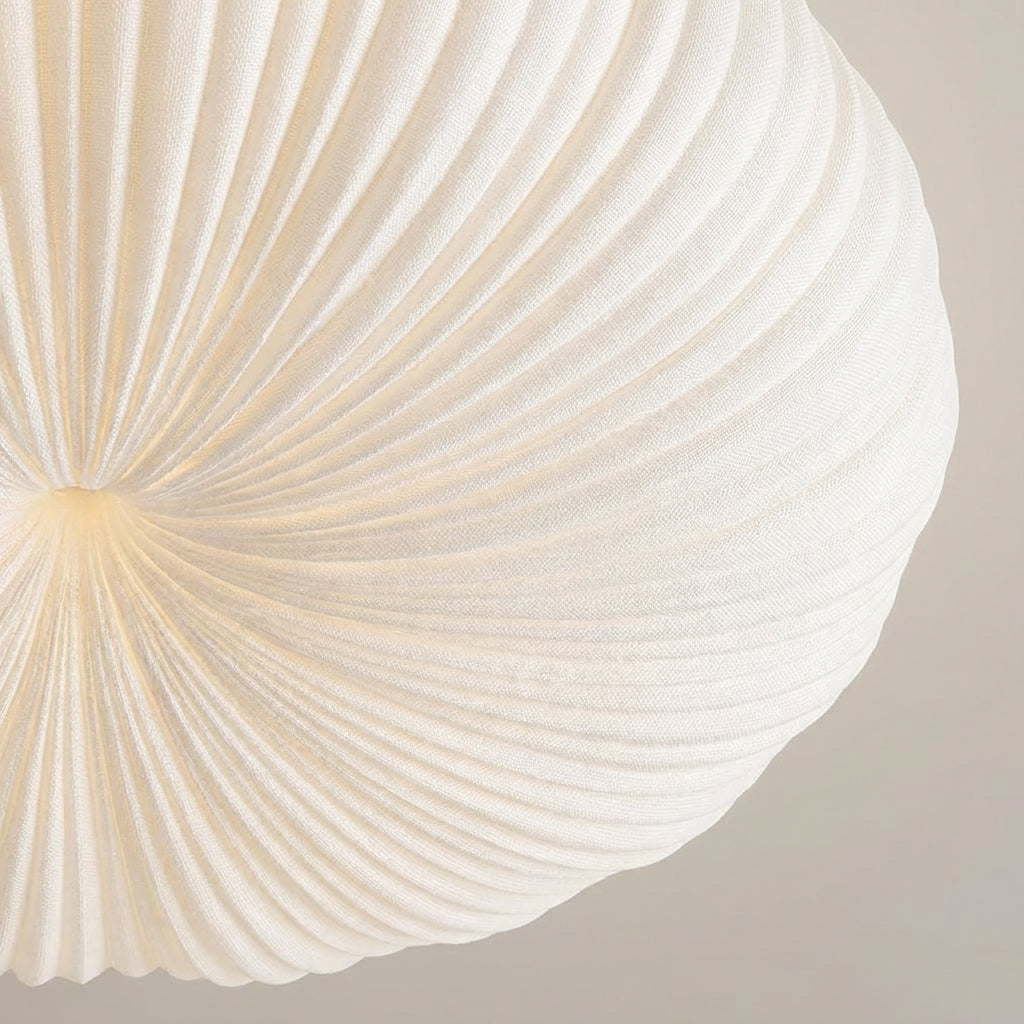 Sculpted modern flush mount ceiling fixture with integrated LED lighting, creating a unique ambient glow.