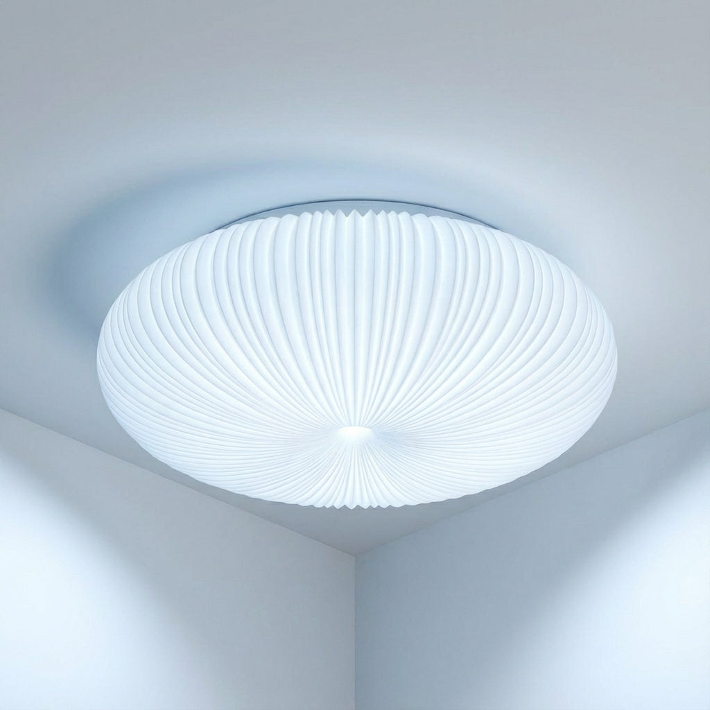 Minimalist modern flush mount LED light, providing sophisticated sculpted ambient glow for contemporary interior design.