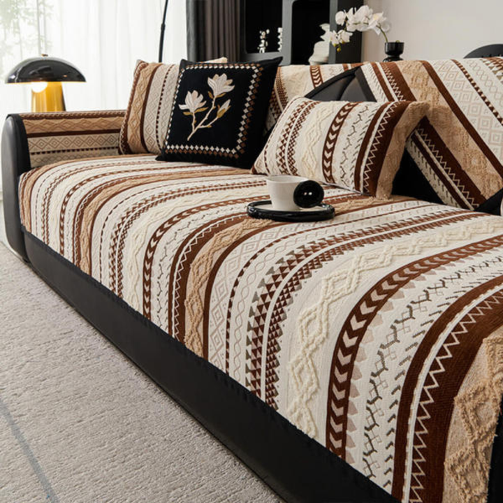 Close-up of non-slip suede sofa cover with modern color block design, protecting furniture from pets