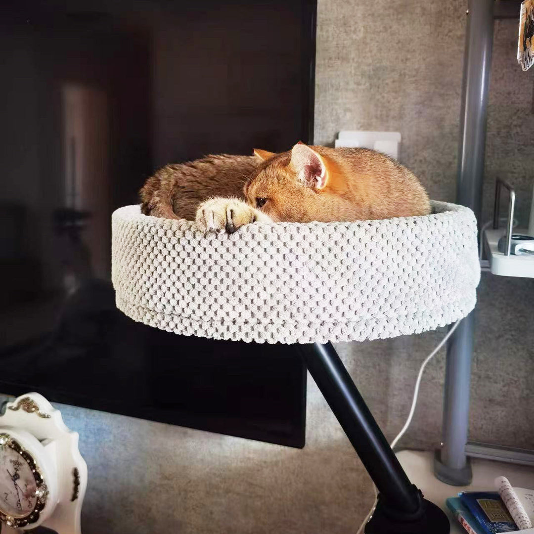 Desk-mounted cat bed with sleek lines, a statement piece of modern pet furniture for any office.