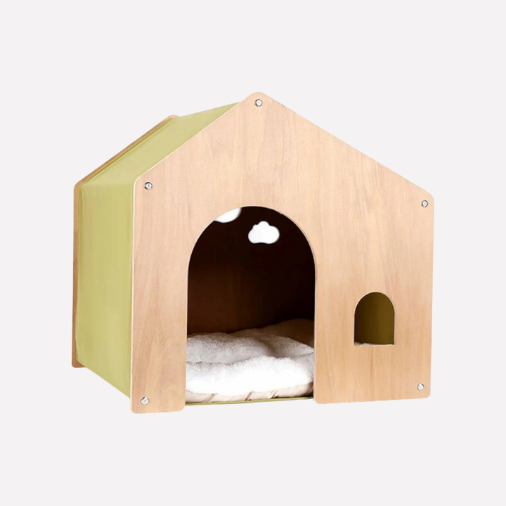 Close-up of a modern wooden cat bed showcasing the soft, removable cushion and sturdy frame.