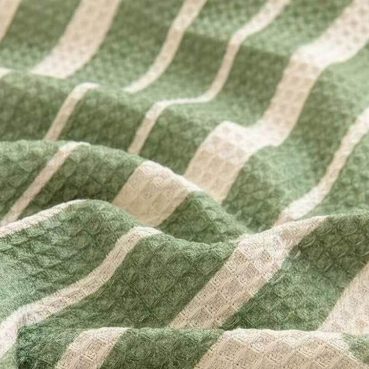 Overhead view of multi-color geometric sofa cover, showcasing modern design and comfort