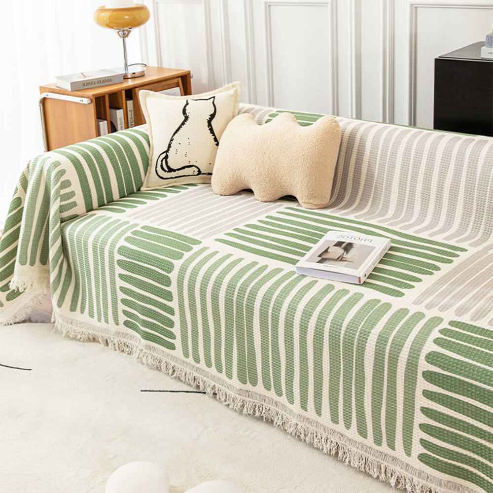 Living room with multi-color geometric sofa cover, offering furniture protection and style