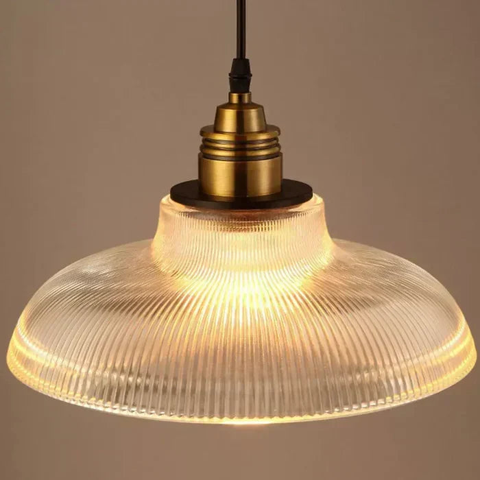 Warm white modern glass pendant light, a stylish ceiling fixture for ambient home decor lighting.