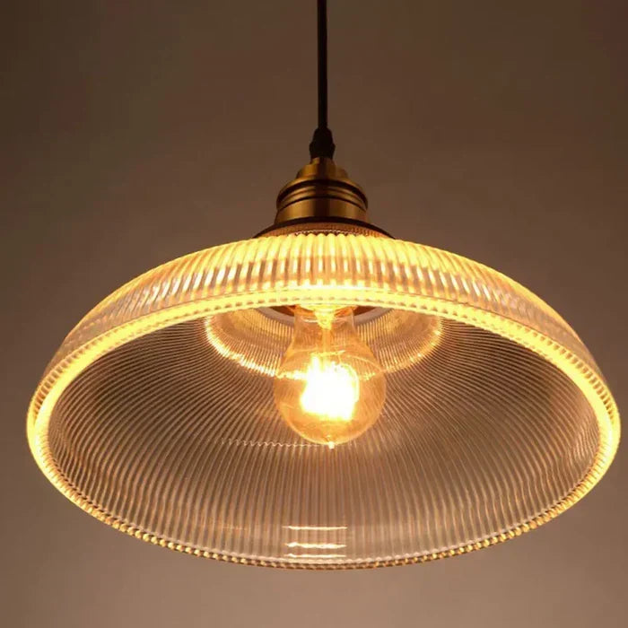 Contemporary glass pendant light adding sleek style & soft ambient light to any modern home decor.