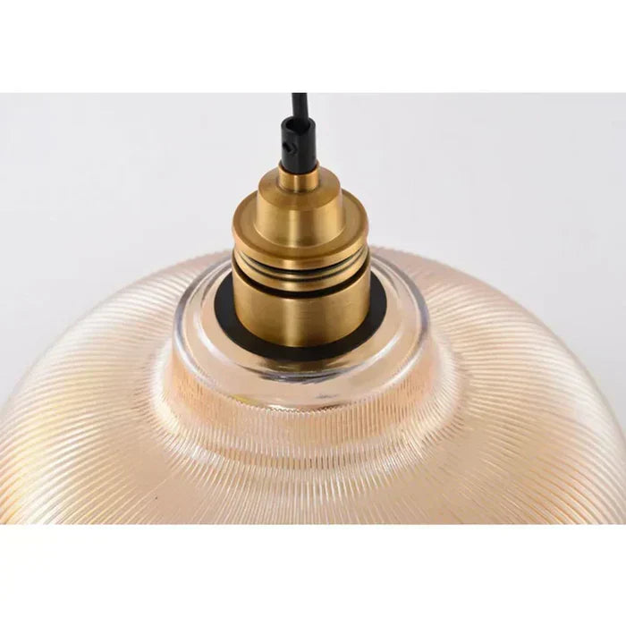 Designer glass pendant light, a chic modern lighting fixture perfect for kitchen island or dining room.