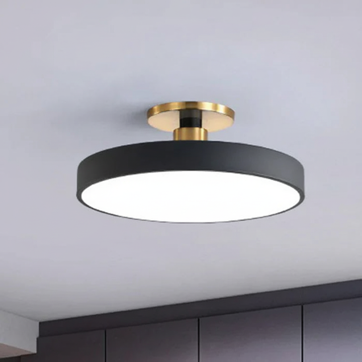 Sleek modern LED ceiling light, semi-recessed, offering soft, glare-free ambient bedroom & kids room lighting.