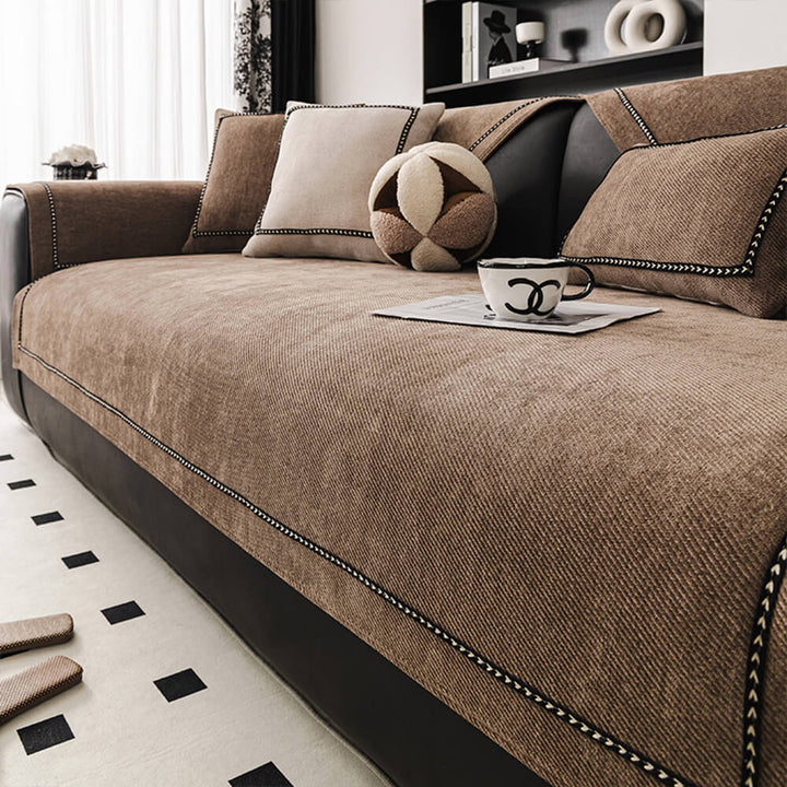 Non-slip chenille couch cover draped over a sectional sofa, showcasing its full coverage and furniture protection