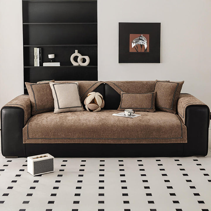 Rear view of a modern jacquard chenille couch cover featuring an anti-slip backing, snug fit on a sofa